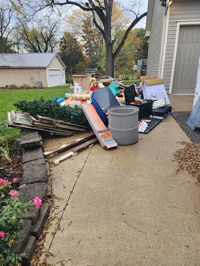 Dumpster being loaded with debris for 30 Yard Dumpster Rental in Roselle Park